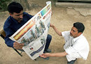 Pakistan cricket fans wake up to read the news of Pakistan's elimination, Islamabad, March 18, 2007