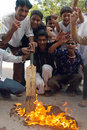 Pakistan cricket fans burn a bat in protest at their side's dismal World Cup performance, Karachi, March 18, 2007