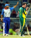 The acting skipper of Asia XI, Virender Sehwag makes a field change as  AB deVilliers looks on during the third ODI of the Afro-Asia Cup at Chennai, June 10, 2007 