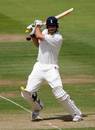 Alastair Cook of England cuts a ball from Dwayne Bravo to the boundary during the fourth day of the first npower test match between England and the West Indies at Lord's cricket ground on May 20, 2007 in London, England