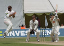 Mark Butcher takes evasive action as Ben Smith drives, Surrey v Worcestershire, Guildford, July 28, 2007