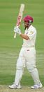 Clinton Perren celebrates his half-century as he guides the Bulls to victory, Queensland v Sri Lankans, 3rd day, Brisbane, November 4, 2007
