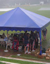 England shelter under a tent as the rain hammers down at Colombo, Sri Lanka Cricket Board President's XI v England XI, Colombo, November 20, 2007 England shelter under a tent as the rain hammers down at Colombo, Sri Lanka Cricket Board President's XI v England XI, Colombo, November 20, 2007