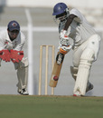Harshad Rawle defends the ball as Parthiv Patel looks on, Gujarat v Railways, Ranji Trophy Plate League Final, Mumbai, 1st day, January 5, 2008 
