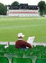 A fan reads the paper after play was called off in Canterbury, Kent v Somerset, Friends Provident Trophy quarter-final, Beckenham, Jun 4, 2008
