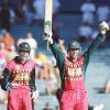Zimbabwe captain Heath Streak (R) and man of the match with a not out 79 off 67 balls, acknowledges the crowd after defeating New Zealand in the series 2-1 at Eden Park, Auckland, New Zealand, 07 January 2001, to take the National Bank Trophy and win Zimbabwe's first ever oversea's one day series. New Zealand succumbed to a late boundary barrage by Streak and a brilliant half century by Andy Flower as Zimbabwe clinched their one-day cricket series by a wicket.