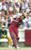 West Indies batsman Brian Lara hits out against the Australian bowling in their match at the MCG in Melbourne, 11 January 2000. Australia scored 267-6 off their 50 overs and then restricted the West Indies to 193-7 from their 50 overs to go one up in the tri-nations series which also includes Zimbabwe