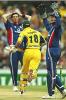 SYDNEY - JANUARY 23: Adam Gilchrist of Australia runs through as Roni Irani and Alec Stewart look on during the first match in the One Day International finals series between Australia and England at the Sydney Cricket Ground in Sydney, Australia on January 23, 2003.