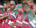 West Indian batsman Brian Lara (C) looks bemused as he opens the envelope after being named man of the series after Australia won the 2nd one-day final against the West Indies to take out the series 2-0 at the MCG in Melbourne 09 February 2001. Australia amassed the huge total of 338-6 with Mark Waugh topscoring with 173 and in reply the West Indies scored 299 to lose by 39 runs.