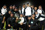 The New Zealand team pose with the National Bank Series trophy after beating England by five wickets to win the series 3-2. Back, from left, manager Jeff Crowe, Chris Harris, Ian Butler, Brendon McCullum, Andre Adams, Daryl Tuffey, Daniel Vettori, coach Denis Aberhart, physiotherapist Dayle Shackel and video analyst Zach Hitchcock. Front, from left, Craig McMillan, Lou Vincent, captain Stephen Fleming (with trophy), Nathan Astle, Chris Cairns and Chris Nevin. 5th ODI: New Zealand v England at Carisbrook, Dunedin, 26 February 2002.