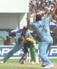 Indian spinner Sunil Joshi (R) raises his hands excitedly as South African batsman Herschelle Gibbs (C) is caught behind by Indian wicket keeper Sameer Dighe (L) on the second one day international cricket match between India and South Africa 12 March 2000, in Jamshedpur in the east Indian state of Bihar. Joshi claimed four vital South African wickets as India went onto win the match by six wickets and take a 2-0 lead in the five match one day series