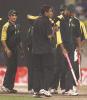 Victorious Pakistanis take stumps out of the ground as souvenirs of a thrilling victory Pakistan v South Africa, Coca-Cola Cup 1999/00, Final, Sharjah C.A. Stadium, 31 March 2000.