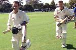 03 Apr 2000: Justin Langer of Australia leads team mate Adam Gilchrist from the field as Australia wins the test, during day four of the third test between New Zealand and Australia, at WestpacTrust Park, Hamilton, New Zealand. Australia won by six wickets.