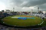 Black clouds hang over Banghabandhu nation stadium in Dhaka as the pitch is covered with plastic 20 April 2003. South African and India are to play the final match of the TVS tri-nation cricket tournament, but heavy rain stopped the match before it could start