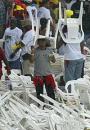 Novel headgear - fans in the downpour that washed out the second ODI