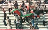 Young Indian supporters at the gallary carry an Indian national flag to give boost to their favourite team during the four-nation Asia Cup limited-overs tournament against defending champions Sri Lanka at the Bangabandhu national stadium in Dhaka. India restricted Sri Lanka 276-8. Asia Cup, 1999/00, 3rd Match, India v Sri Lanka, Bangabandhu National Stadium, Dhaka. 1 June 2000.
