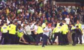 Pakistani fans burst through the lines of police and stewards after Pakistan defeated Australia, 8th ODI at Trent Bridge, 19 June 2001.