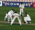 Nicky Phillips of Durham is surrounded by Hampshire fielders as they press for victory, unsighted is the bowler Simon Katich
