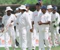 Sri Lanka bowler Muttiah Muralitharan (R) walks back to the pavilion with his teammates just after the fall of South Africa's last wicket during the fourth day of the first cricket Test between South Africa and Sri Lanka. Muralitharan took 13 wickets for 171 runs as Sri Lanka won the match by an innings and 15 runs to take a 1-0 lead in the three match series. South Africa in Sri Lanka, 2000/01, 1st Test, Sri Lanka v South Africa, Galle International Stadium, 20-24 July 2000 (Day 4).