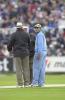 The umpires in earnest discussion concerning the weather as Ganguly waits on, England v India at Chester-le-Street, July 2002
