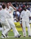 Ashley Giles celebrates as Brian Lara looks on disconsolately, England v West Indies, 1st Test, July 23, 2004
