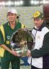 Captains Shaun Pollock and Steve Waugh pose with the Pentasoft Super Challenge 2000 Trophy after their one day cricket match played under a closed roof at the Colonial Stadium in Melbourne. Being played in the middle of winter in Melbourne, South Africa scored 206-7 from their 50 overs and restricted Australia to 198-9 to draw the three match series 1-1 with one game tied. South Africa in Australia, 2000/01, 3rd One-Day International, Australia v South Africa, Colonial Stadium, Melbourne, 20 August 2000.