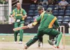 Pakistan's Abdur Razzaq (C) looks back after batting against South Africa during the Singapore Challenge 2000 as South Africa's Nicky Boje (L) looks on. Pakistan made 227 for nine off their 50 overs against South Africa. Player at right is unidentified. Godrej Singapore Challenge, 2000/01, 2nd Match, Pakistan v South Africa, Kallang Ground, Singapore 23 August 2000.