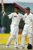 Mohammad Hafeez (L) acknowledges the crowd after his first Test century while teammate Yasir Hameed looks on during the fourth day of the second Test between Pakistan and Bangladesh in Peshawar, 30 August 2003.