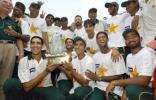 The jubilant Pakistan team poses with the trophy after their 1-wicket win,  Pakistan v Bangladesh, 3rd Test, Multan, September 6, 2003.