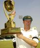 Australian captain Steve Waugh holds cricket trophy at Sharjah Cricket Stadium October 22, 2002. Australia won the Sharjah Test by an inning and 20 runs against Pakistan.