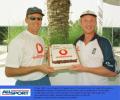 Alec Stewart (man of the match) helps Matthew Fleming (who took four wickets) celebrate his birthday and also England's seven run win over India in the opening match of the Champions Trophy in Sharjah.