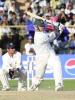 Zimbabwe skipper Heath Streak hits a ball to boundary as Indian wicketkeeper Vijat Dahiya (L) looks on during the third one-day cricket match in Jodhpur 08 December 2000. Zimbabwe won the match by one wicket off the penultimate ball to record their fist win in the five-match series.