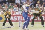 Sri Lanka's batsman Sanath Jarasuriya is bowled out 15 December 2000, during the One Day International test match between South Africa and Sri Lanka at the Saint George's cricket ground in Port Elizabeth. Watching behind are South African fielders Lance Klusener (L) and Jacques Kallis.