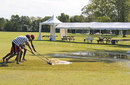 Groundsmen work to remove water from the ground, Canada v Kenya, 2nd ODI, King City, August 22, 2009