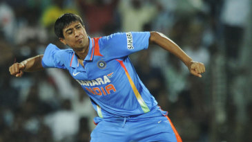 Rahul Sharma celebrates the wicket of Sunil Narine 