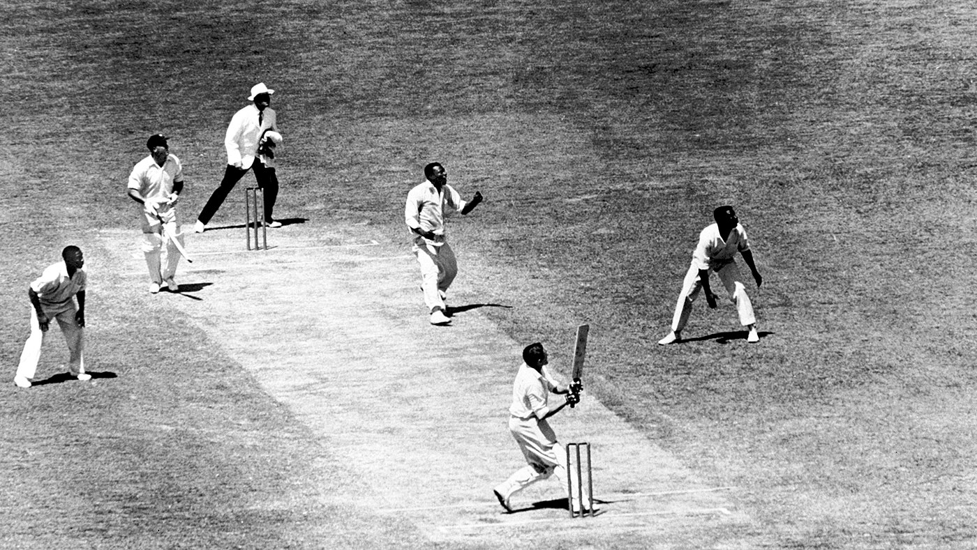 Alan Davidson hooks Wes Hall during the famous 1960-61 series in Australia