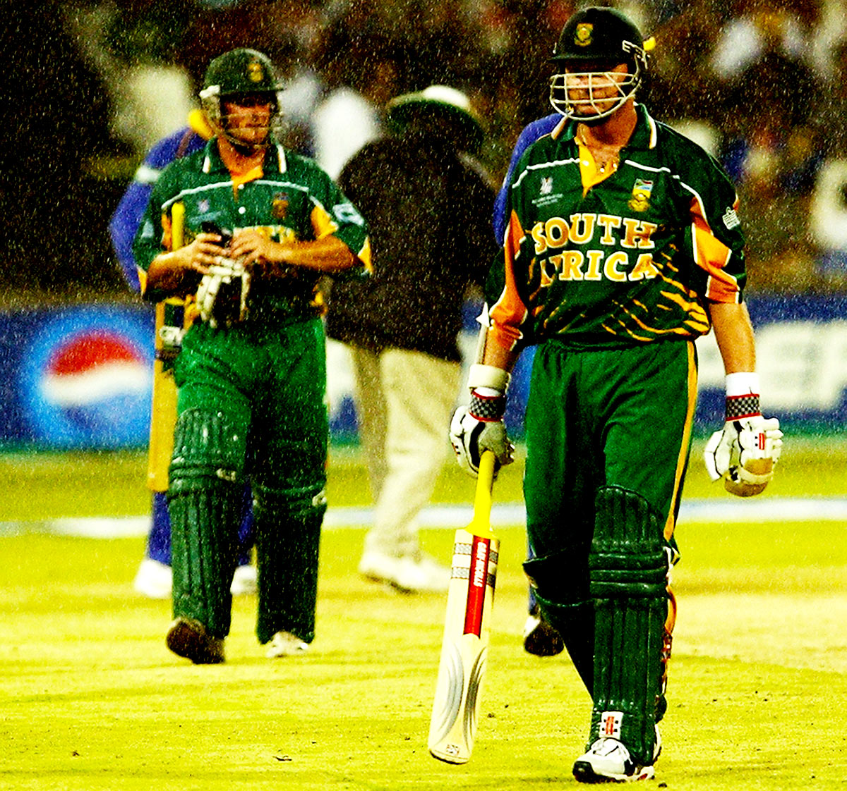 Mark Boucher and Lance Klusener walk off in the rain