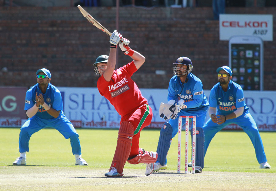 Kyle Jarvis lofts the ball | Photo | Zimbabwe v India | ESPNcricinfo.com