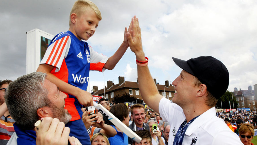 Joe Root high-fives a young England supporter Joe Root high-fives a young England supporter