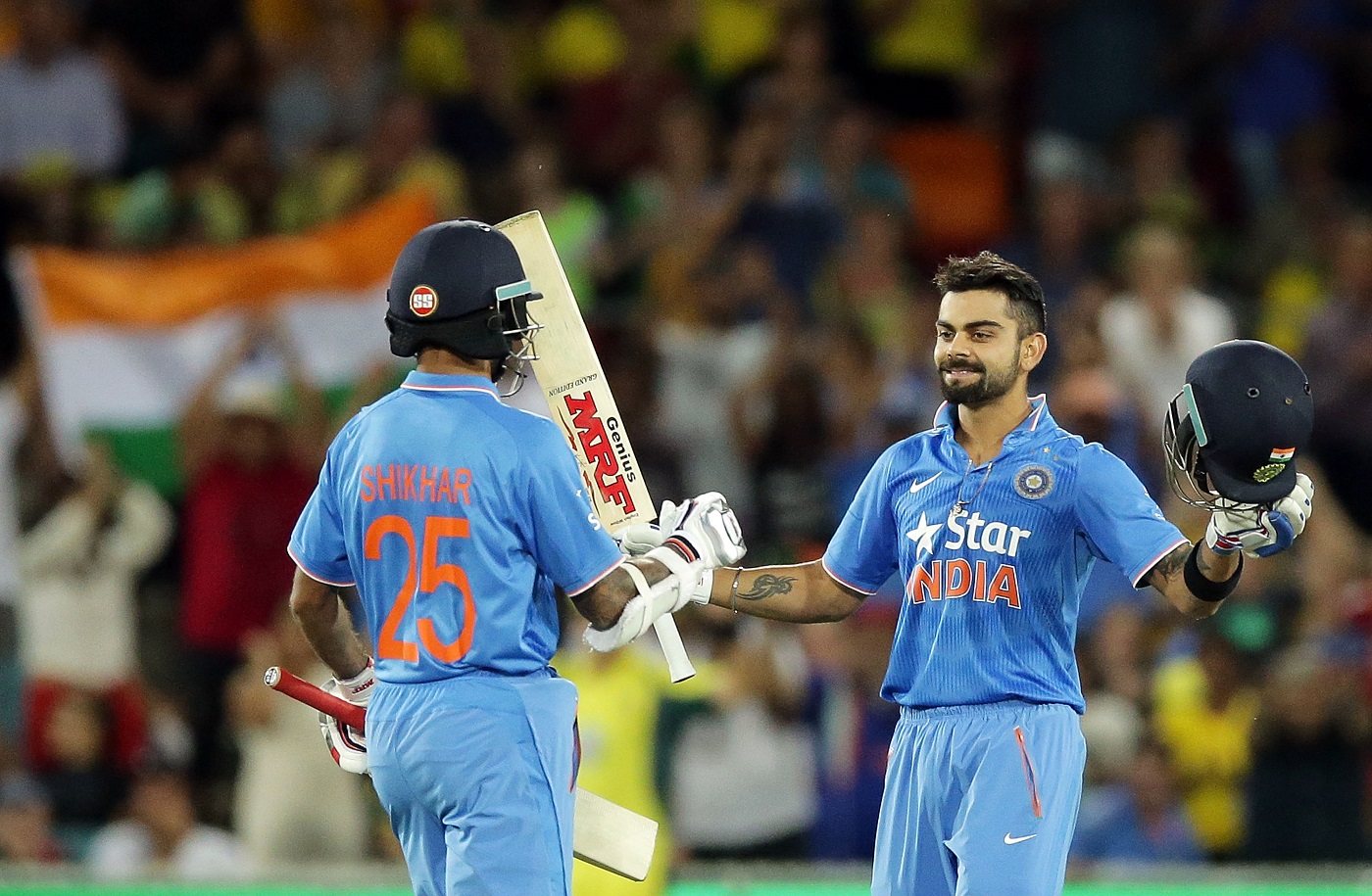 Virat Kohli celebrates his ton with Shikhar Dhawan | Photo | Australia v India | ESPNcricinfo.com