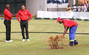 Umpires Jeremiah Matibiri and Shaun George watch ground staff attempt to dry the outfield, Zimbabwe v Afghanistan, 5th ODI, Harare, February 26, 2017