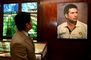 Sachin Tendulkar poses with his portrait at the Lord's museum, London, July 10, 2025