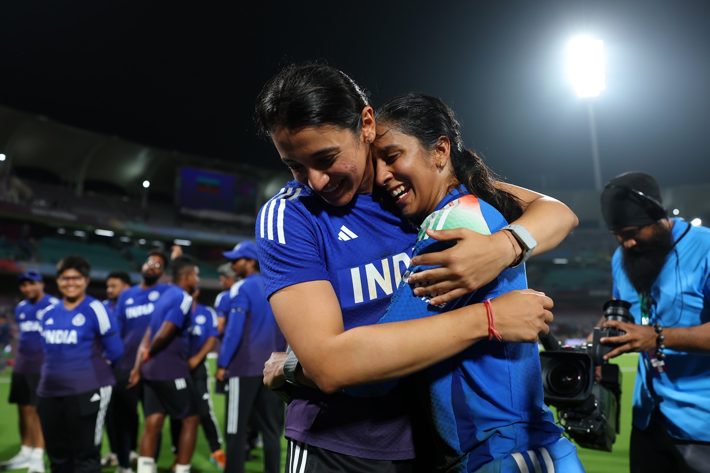 We did it, friend: Smriti Mandhana and an emotionally and physically expended Jemimah Rodrigues soak up that winning feeling after beating Australia in the World Cup semi-final