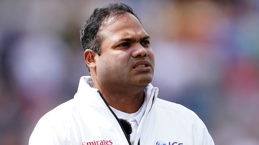 Umpire Nitin Menon looks on