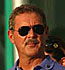Allen Stanford surveys his ground after defending his tournament to the media